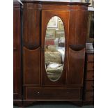 A Victorian gentleman's wardrobe in banded and quarter veneered mahogany with boxwood stringing. The