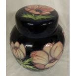 Moorcroft seconds poppy ginger jar, dark blue ground with pink flowers, height 21cm, the base