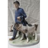 Royal Copenhagen porcelain figural group of boy leading two calves, on an oval naturalistic base,