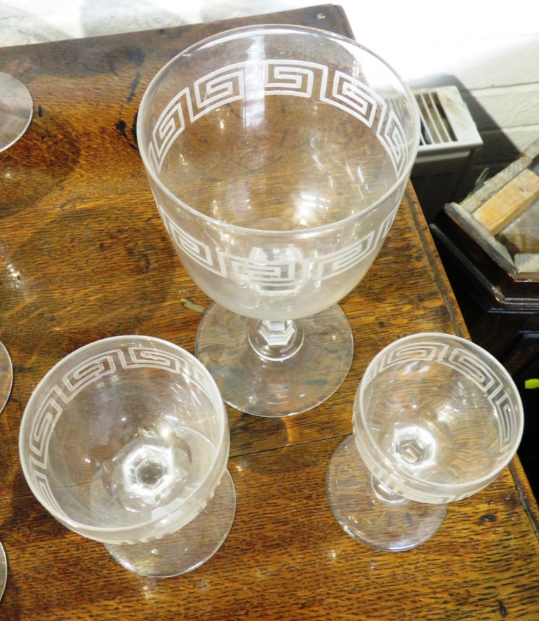 A suite of drinking glasses and a near pair of bottle shape decanters, all etched with key fret - Image 6 of 8