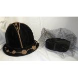 A lady's black velvet cloche hat with brown corded swirls and a Mode de Paris price ticket fixed