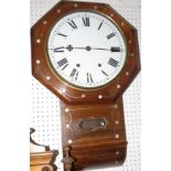 A Victorian octagonal rosewood wall clock with mother of pearl inlay and a lower glass pendulum