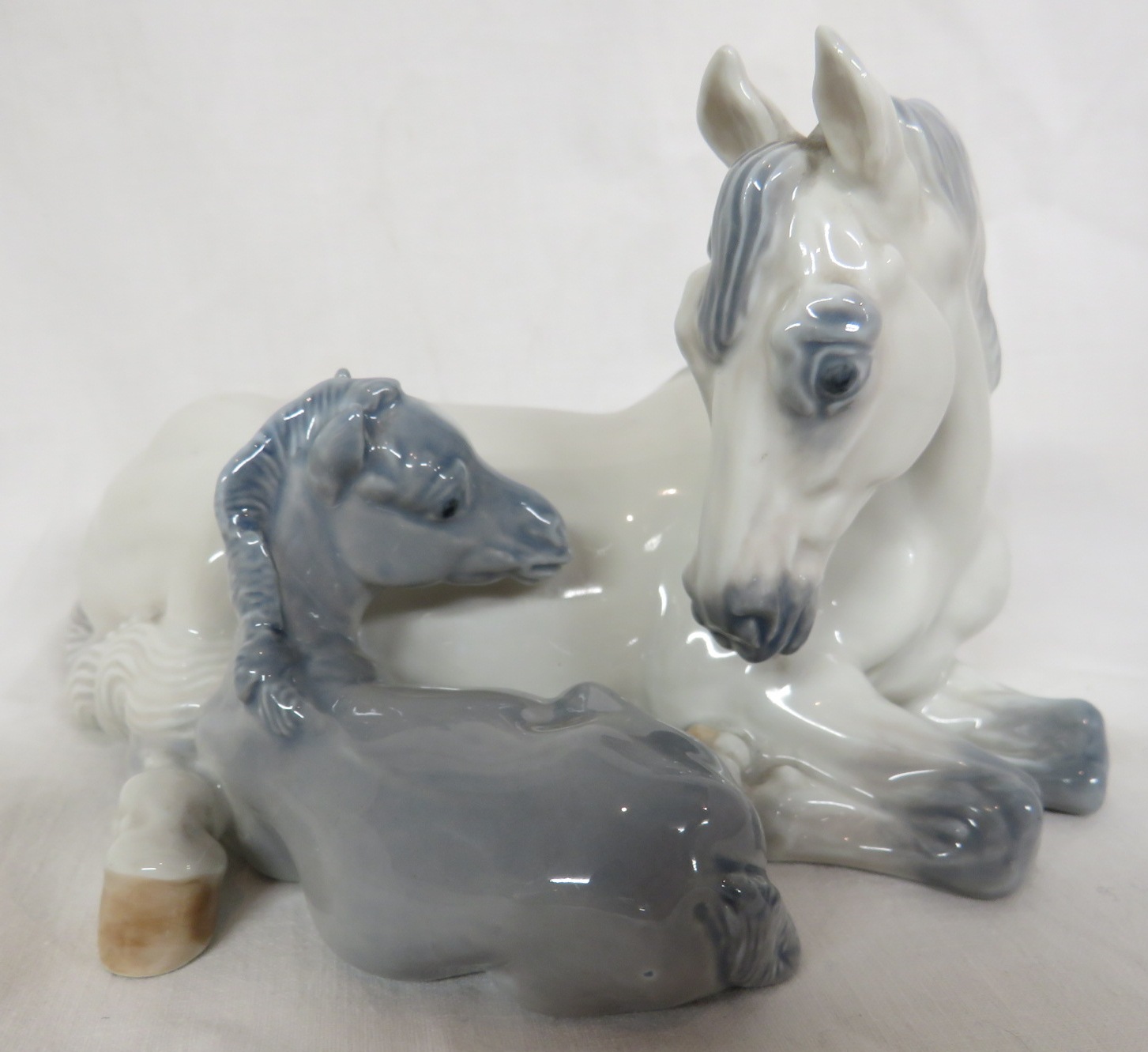 Royal Copenhagen porcelain figural group of mare and foal, numbered 4698, (length 18cm, height