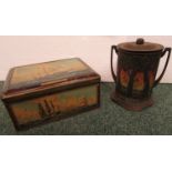 A Huntley & Palmer pictorial biscuit tin of cylindrical form with two handles and decorated with