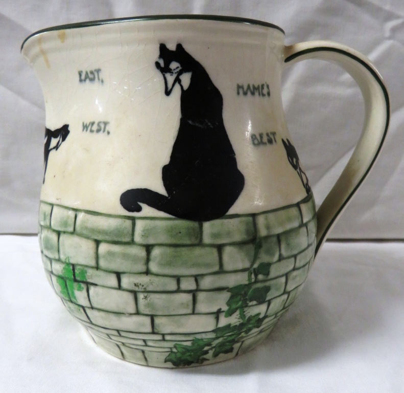 Royal Doulton H Souter jug decorated with four black and white cats on a wall grown with ivy and