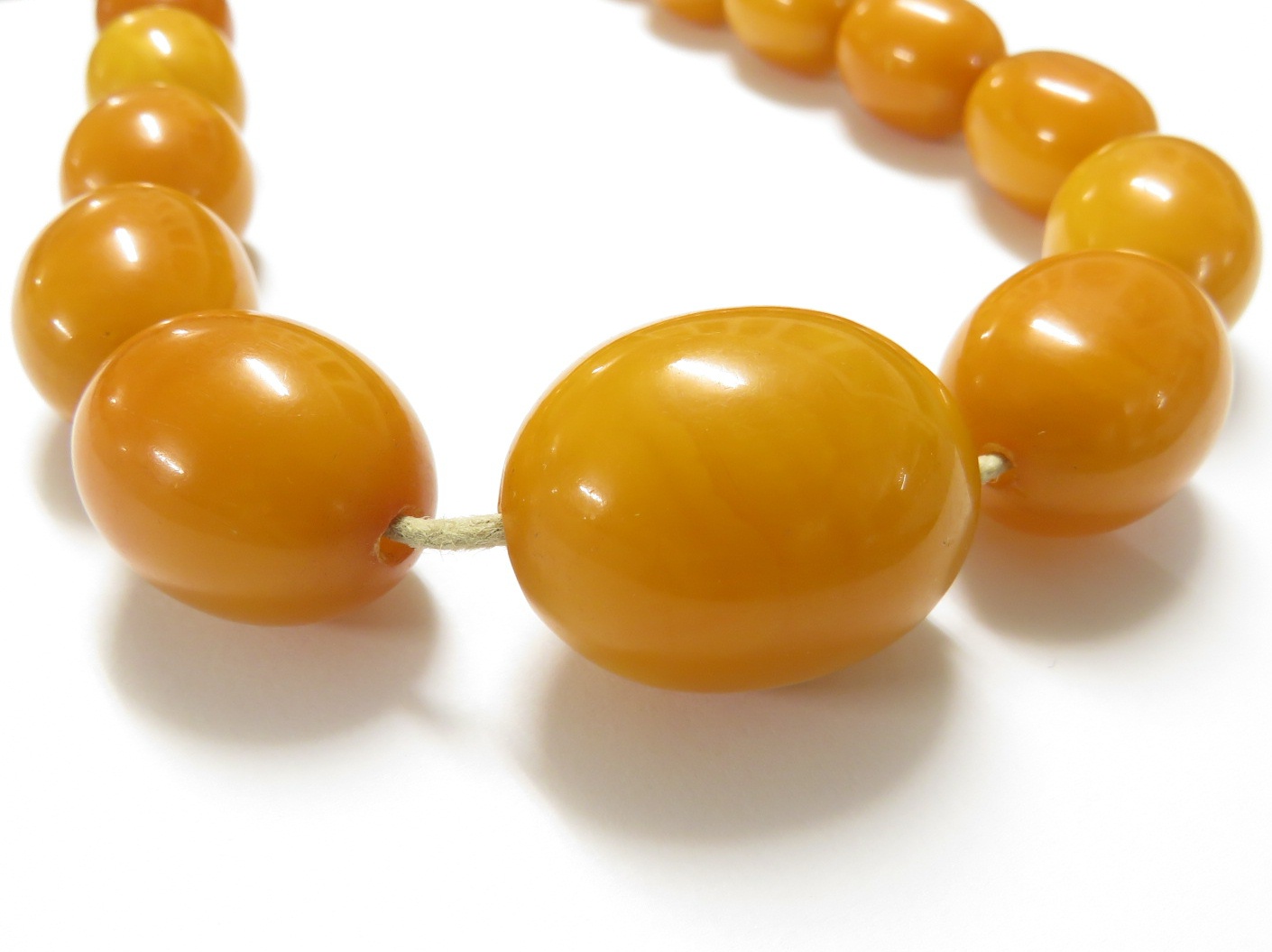 A necklace of graduated amber beads, length about 112cm, the largest bead approximately 3cm long - Image 2 of 6