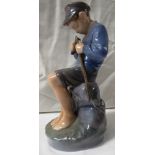 Royal Copenhagen porcelain figure of a seated fishing boy whittling a stick, numbered 905, height