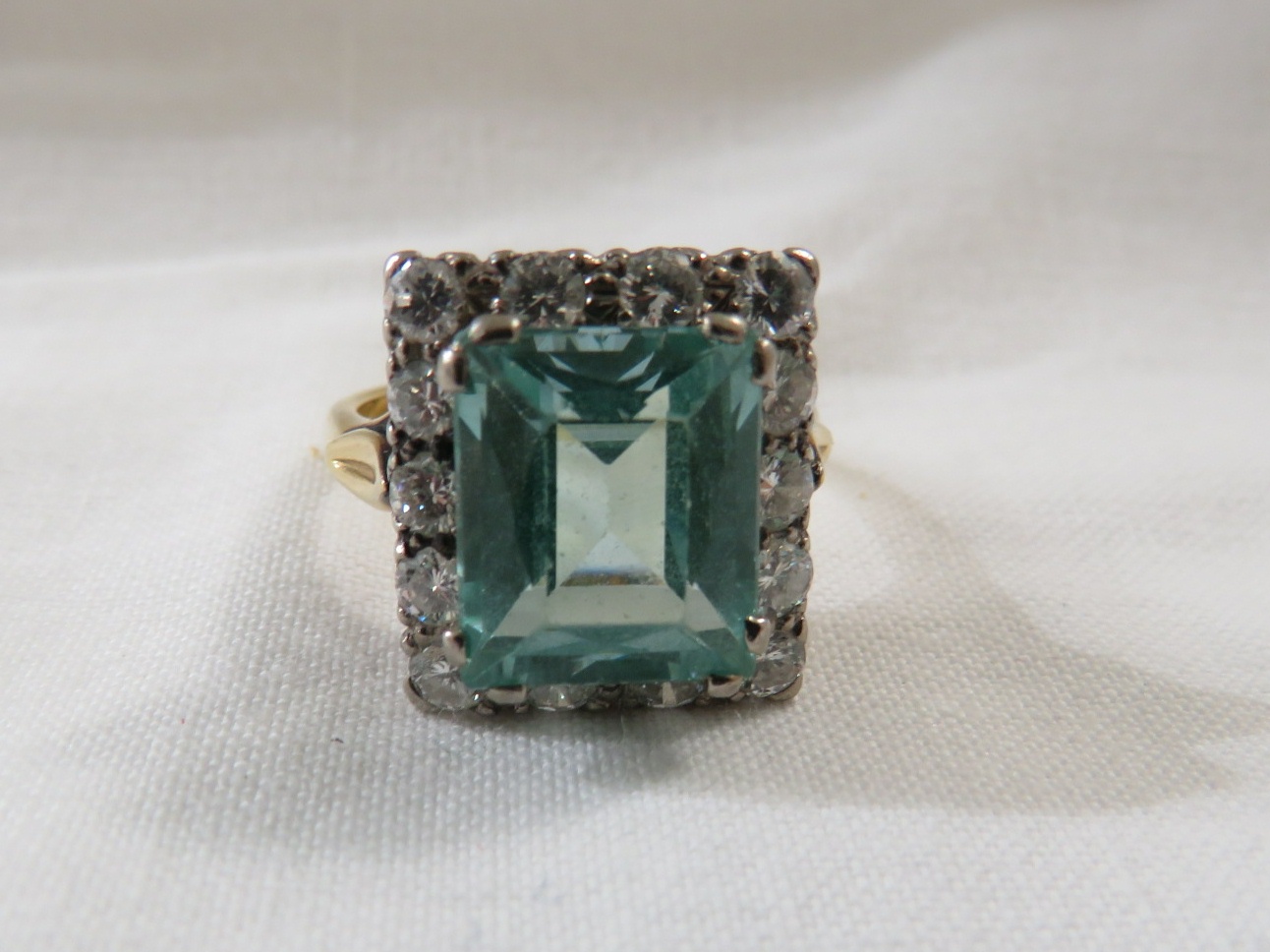 18ct gold ring set with an aquamarine (emerald cut 11.5mm x 10mm approximately) within a border of - Image 2 of 3