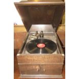 His Master's Voice gramophone in an oak casing, the integral speaker behind a pair of hinged doors