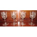 Four 19th century wine glasses, the bowls etched with vines, the stems with octagonal knop, height