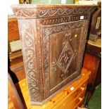 CARVED OAK CORNER WALL CUPBOARD WITH SINGLE DOOR (A/F)