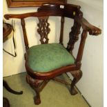 CARVED MAHOGANY FRAMED CORNER CHAIR STANDING ON BALL AND CLAW FEET WITH UPHOLSTERED SEAT
