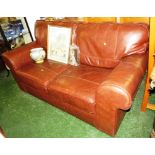 TAN LEATHER TWO SEATER SOFA AND TWO BROWN LEATHER EFFECT POUFFES