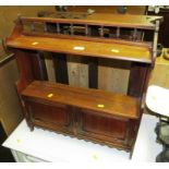 MAHOGANY WALL SHELF WITH TWO DRAWER CUPBOARD TO BASE AND ONE OTHER CARVED MAHOGANY WALL SHELF