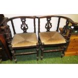 PAIR OF ORNATE MAHOGANY CORNER CHAIRS WITH TURNED LEGS AND STRETCHERS, AND RUSH WOVEN SEATS