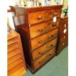 An early 19th century mahogany tall and narrow chest of five graduated drawers with brass