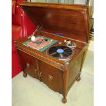 Baxterphone gramophone in oak cabinet, the two doors opening to reveal a triple divided and labelled