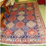 LARGE BLUE GROUND WOOLLEN PATTERNED FLOOR RUG WITH THREE MARGINS AND CENTRAL MEDALLIONS