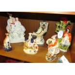 Six Staffordshire pottery figures and animals - flatback kilted couple with clock (height 36cm),