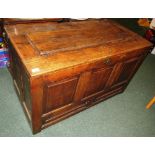 A late 18th / early 19th century large oak three panel coffer with replacement hinges, brass