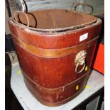 OAK COAL OR PEAT BUCKET WITH BRASS BANDING AND LIONS MASK HANDLES, STANDING ON CASTORS