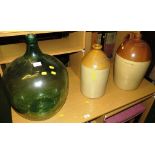 GLASS CARBOY, AND TWO STONEWARE BOTTLES