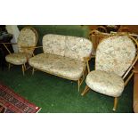 ERCOL LIGHT ELM FRAMED THREE PIECE SUITE COMPRISING TWO SEATER SOFA, ARMCHAIR AND ROCKING CHAIR, ALL