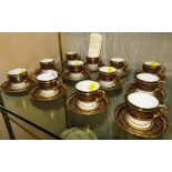 SET OF TWELVE IL BERNARDAUD & CO LIMOGES CHRISTOFLE GILT GLAZED AND DECORATED COFFEE CUPS AND