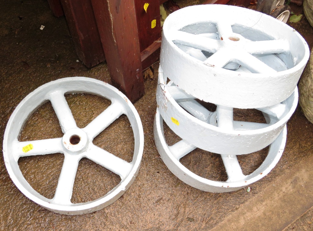 FOUR PAINTED VINTAGE CAST METAL WHEELS