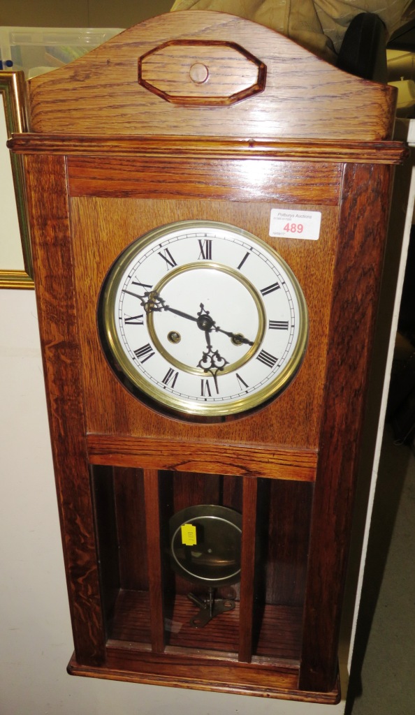 OAK CASED CHIMING WALL CLOCK WITH WINDING KEY