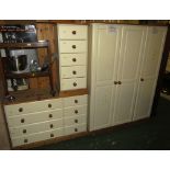 CREAM PAINTED PINE BEDROOM SUITE COMPRISING THREE DOOR WARDROBE, EIGHT DRAWER WIDE CHEST AND TALL