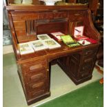 SUBSTANTIAL OAK ROLL TOP DESK WITH TAMBOUR FRONT AND NINE DRAWERS TO BASE (A/F)