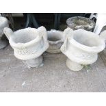 TWO COMPOSITE STONE TWO HANDLED URNS