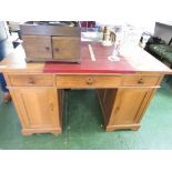 OAK PEDESTAL DESK WITH RED LEATHER SCRIBER, THREE DRAWERS AND TWO CUPBOARDS