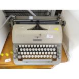 VINTAGE ADLER TYPEWRITER WITH COVER