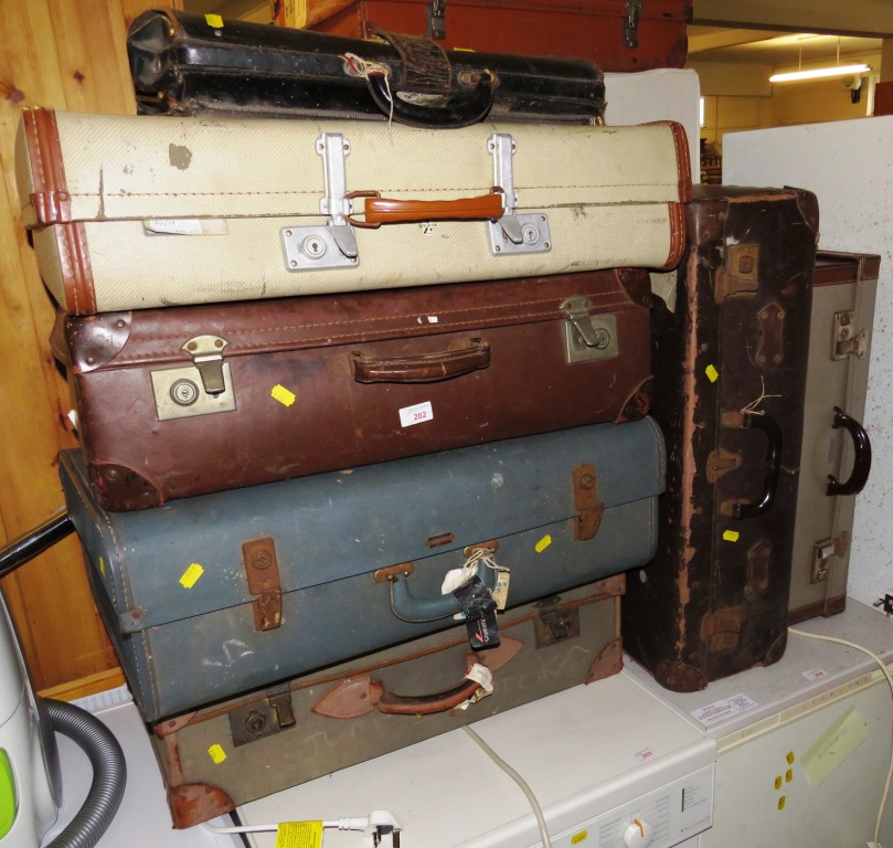 SIX VINTAGE TRAVEL CASES AND LEATHER BRIEFCASE