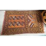 SMALL RECTANGULAR BROWN GROUND HAND WOVEN RUG WITH MEDALLIONS AND STYLIZED TREES