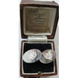 A pair of silver fox head cufflinks, oval settings, Birmingham assay, maker's stamp WM, combined