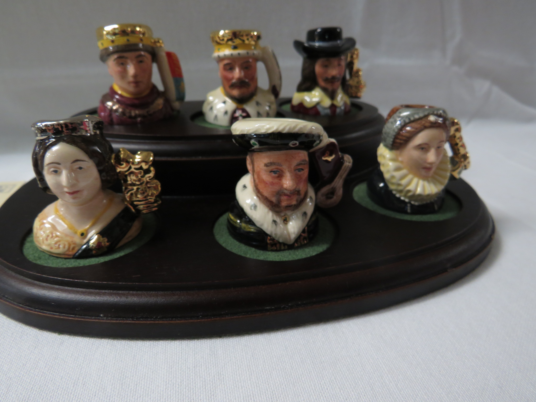 Royal Doulton Kings and Queens of the Realm collection of six hand-made miniature character jugs