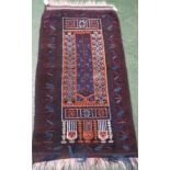 An Iranian blue ground prayer rug with single rectangular reservation bordered with boxed star