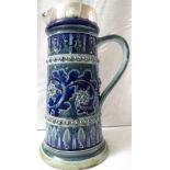 Doulton Lambeth ewer of tapering cylindrical form with silver rim and spout, blue and green glaze