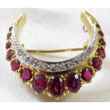 **Payment in person or by bank transfer only**An 18ct gold ruby and diamond crescent or horseshoe