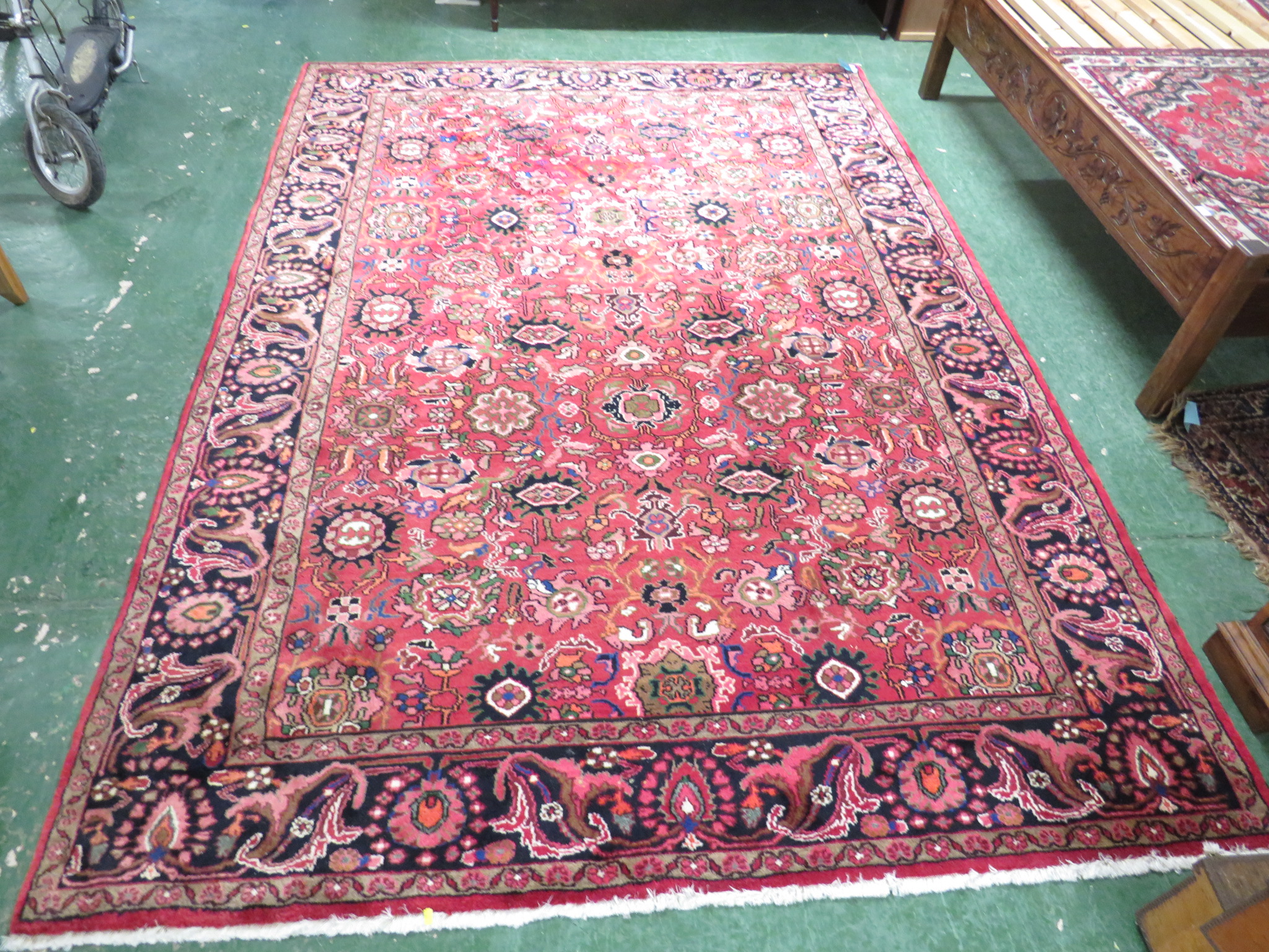 An Iranian carpet with three floral margins, a central reservation with single medallion and - Image 2 of 3