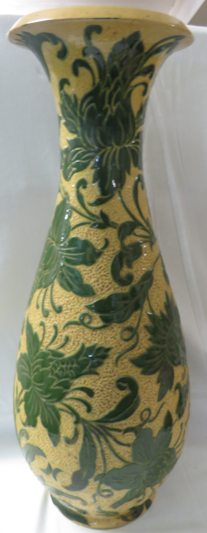 A large Lauder Barum pottery vase of baluster shape with a flared neck, yellow ground with dimpled