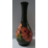 Moorcroft pottery bottle vase, green ground painted with pink anemones, stamped MOORCROFT MADE IN