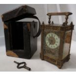 A heavy brass carriage clock with blind fret tracery and reeded square pilasters to the corners,