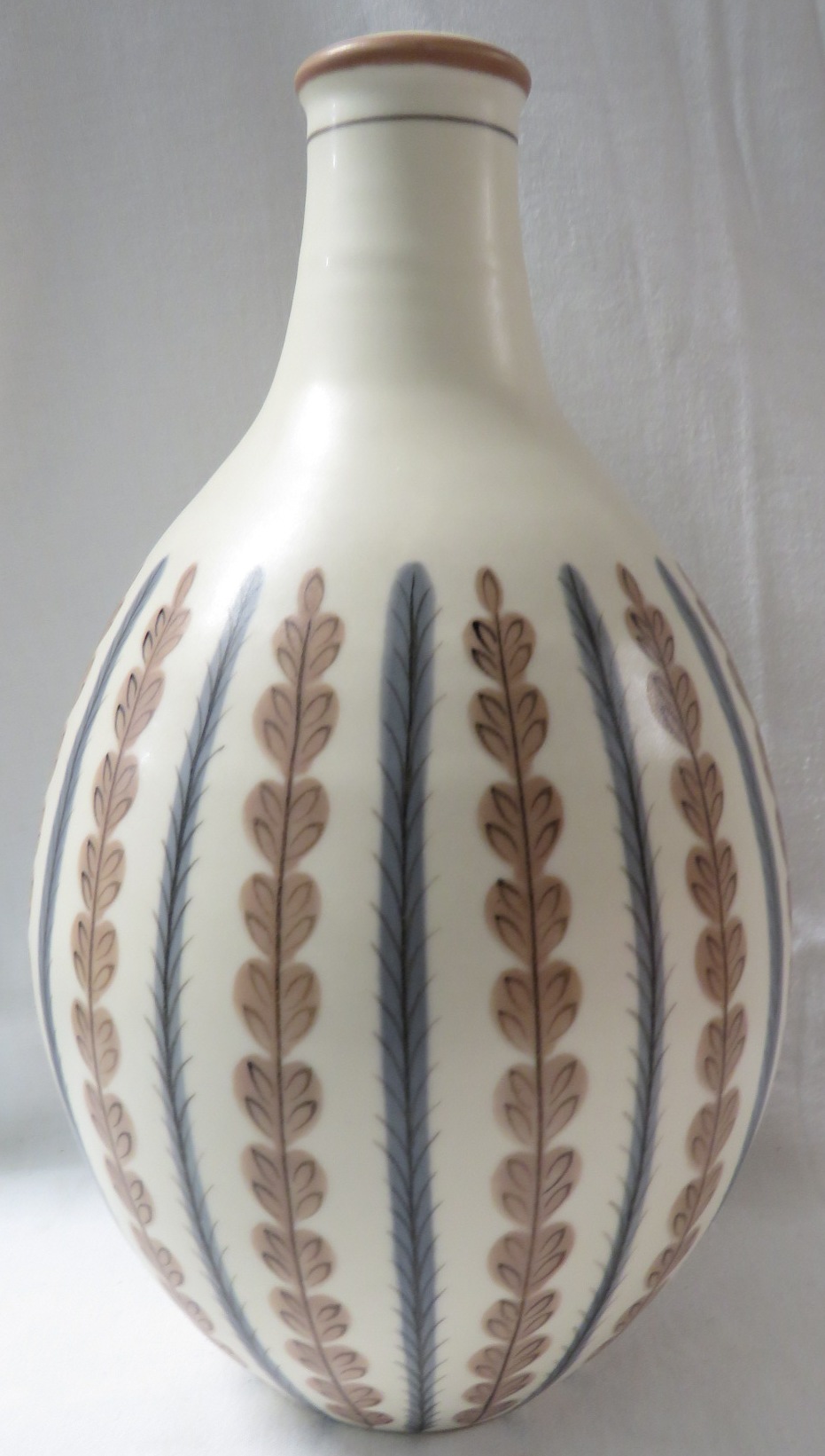 Poole pottery ovoid vase, cream ground with vertical lines of stylized leaves alternately in brown