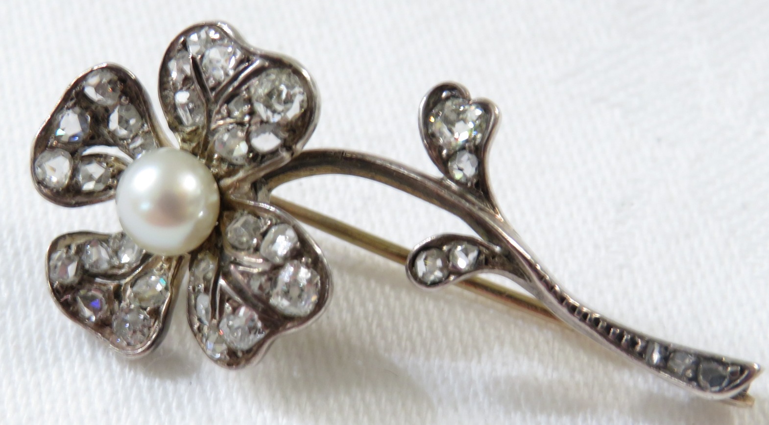 **Payment in person or by bank transfer only**A floral spray diamond brooch, set with thirty-six