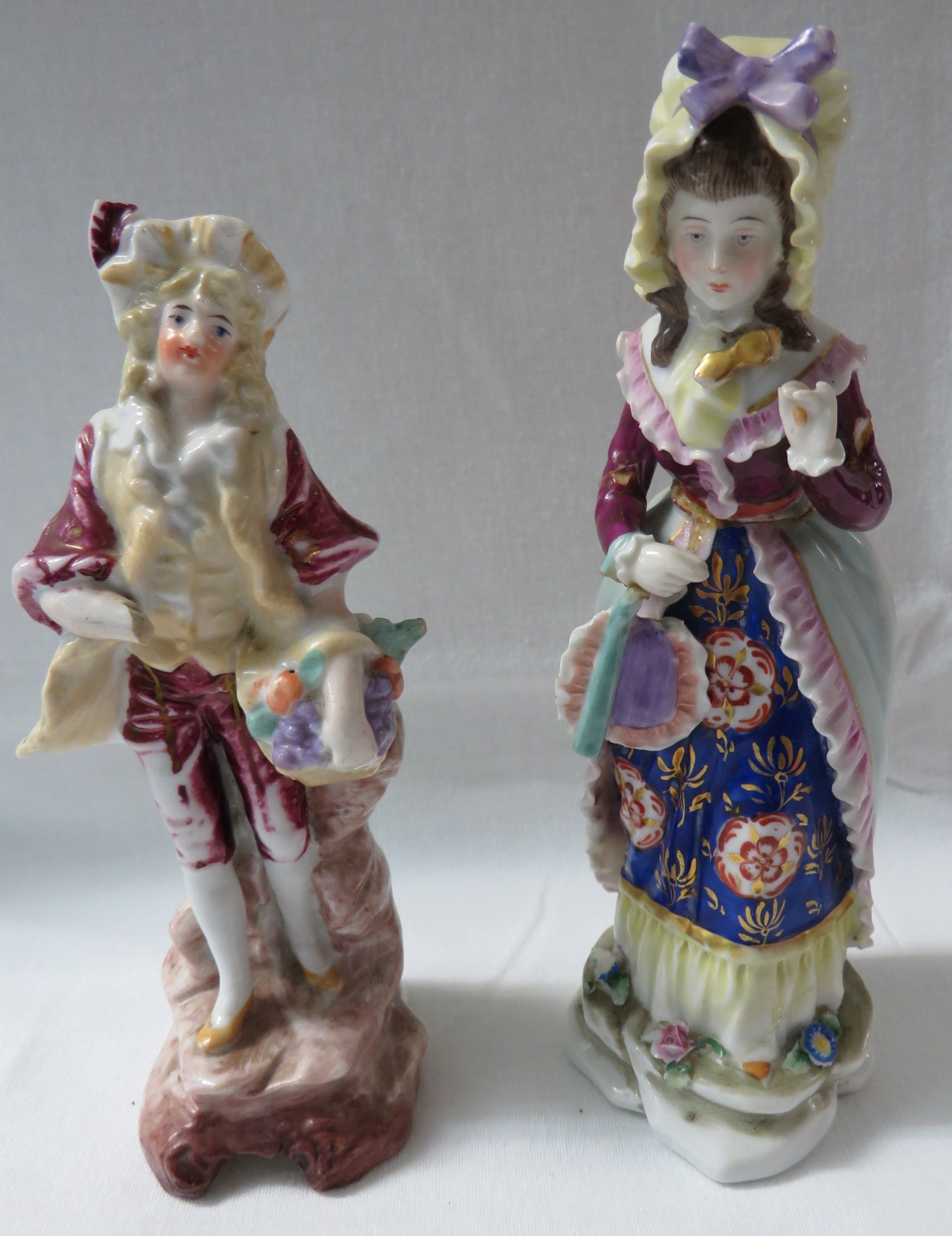 A continental porcelain figure of lady with fan and lorgnette (damaged) with the mark of Hochst to