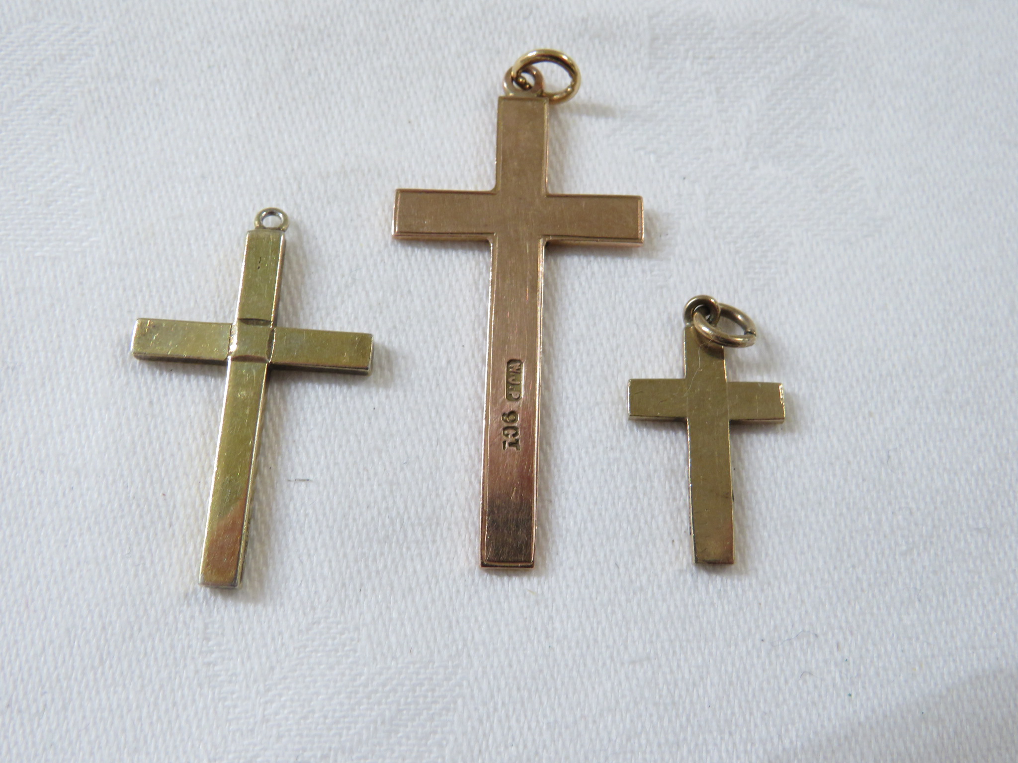 9ct gold cross pendant engraved 1939, (3.3g), a small 9ct gold cross pendant, (1.5g), and a gold - Image 2 of 2